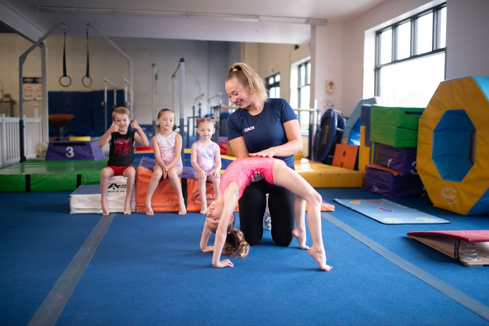 Learn more about beginner gymnastics skills, from backbends to cartwheels, round-offs, and other introductory tricks.